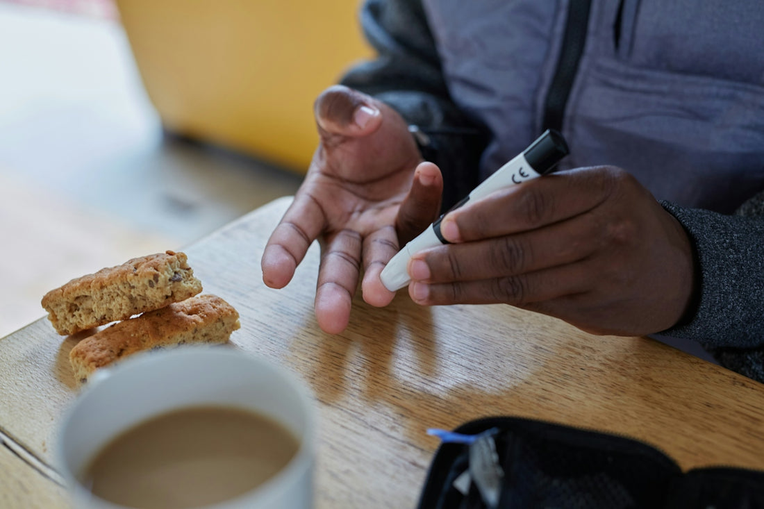 a person doing a finger prick test for blood glucose