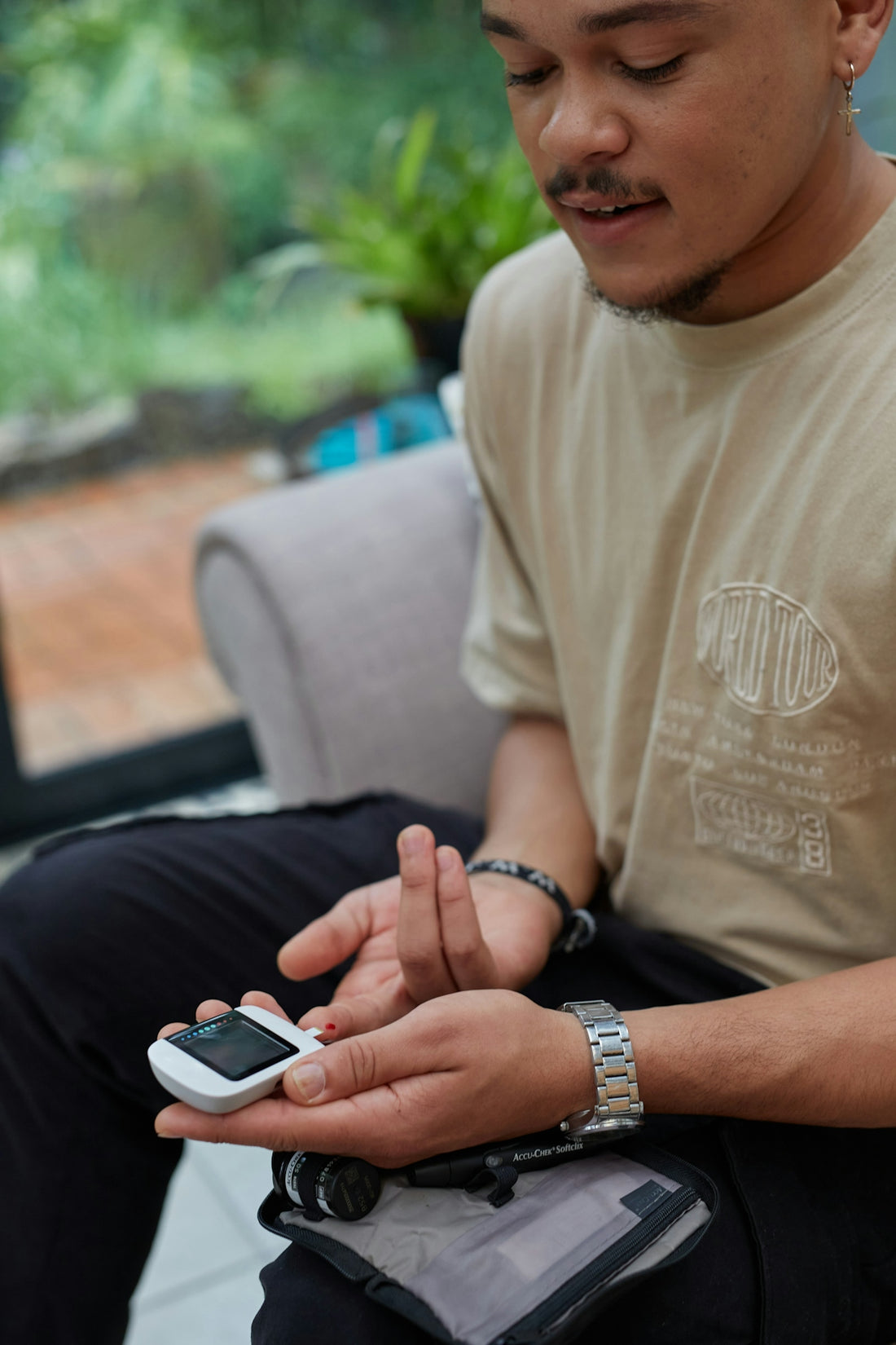 a person blood glucose testing using gluco-meter